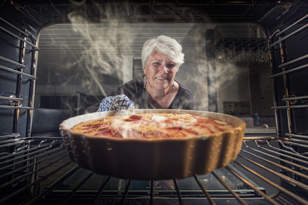 Woman is cooking pie